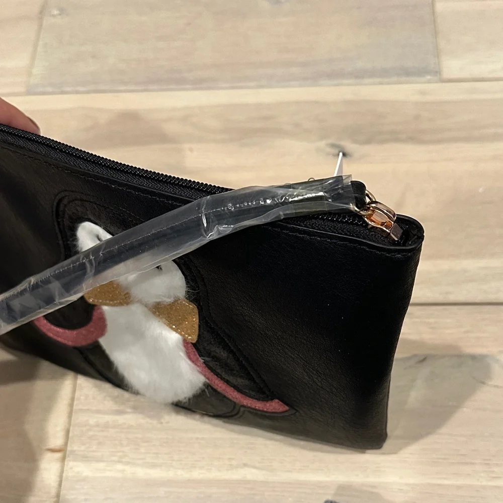LC Lauren Conrad Penguin Black Clutch Bag with Gold and Pink Accents